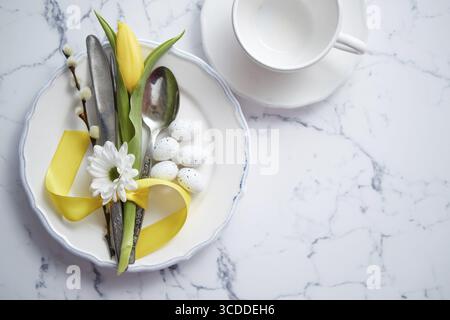 Spring Easter Table setting at white marble table. Top view. Flat lay with copy space Stock Photo