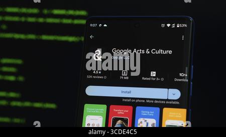 Google Arts & Culture app shown on a smartphone with a dark theme, highlighting ratings and download options Stock Photo