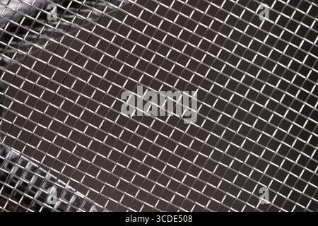 Abstract black and white background of metal wire mesh. Texture of metal mesh Stock Photo