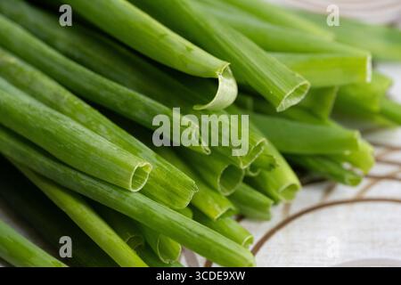 Fresh green onions on a white wooden background Stock Photo