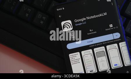 Google NotebookLM app on smartphone screen with install option, dark theme Stock Photo