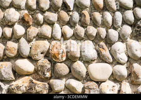 A pebble wall at Greyfriars Monastery (aka Greyfriars Medieval Friary) Dunwich, Suffolk, England, UK Stock Photo