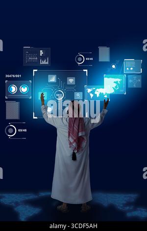 Digital strategist interacting with futuristic technology in a virtual workspace at night Stock Photo