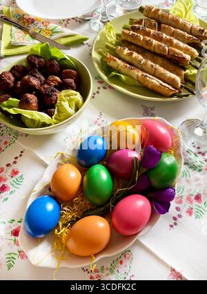 Traditional Easter food. Russian salad, Easter eggs, appetizer, meatballs. Family gathering concept. Holiday season. Directly above. Stock Photo