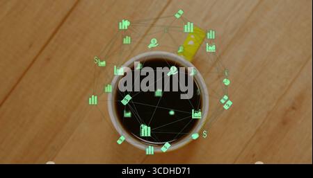 Displaying white ceramic coffee mug with floating green financial icon network on wooden tabletop Stock Photo