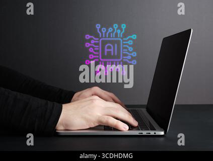 Software engineer working on a laptop is developing artificial intelligence using machine learning algorithms Stock Photo