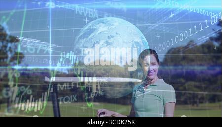 Gloved golfer in polo holding club on golf course, holographic globe with binary charts, copy space Stock Photo