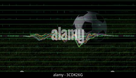 Displaying soccer ball resting on grass field at night, with floating data grid and waveform graph Stock Photo