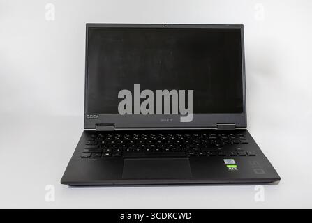 Omen Black Laptop with a blank screen on a white background Stock Photo