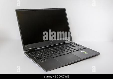 Omen Black Laptop with a blank screen on a white background Stock Photo