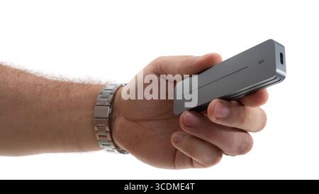 Modern device held in hand showcases sleek design and advanced technology for everyday use in various settings Stock Photo