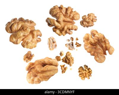Walnuts swirling in air against white background Stock Photo