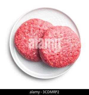 Raw burger beef patties on plate isolated on a white background. Stock Photo