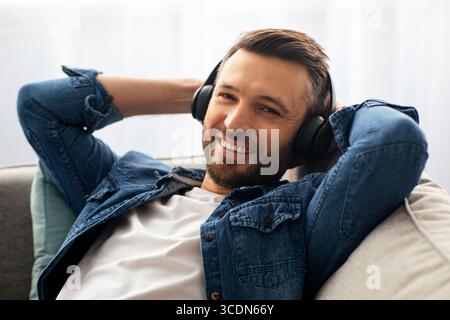 Closeup portrait of bearded man in wireless headset Stock Photo