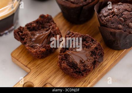 Chocolate chip muffins mini size with chocolate filling split in half, double chocolate muffins Stock Photo