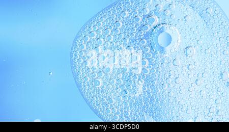 Light blue background closeup of Oil Drops in Water. Abstract macro photo of liquid Surface with Bubbles. abstract macro cool Stock Photo