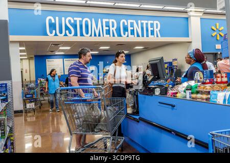 North Miami Beach Florida,Walmart Supercenter,big-box department store shopping,inside interior,self-service checkout scan & go,man male adult Hispani Stock Photo