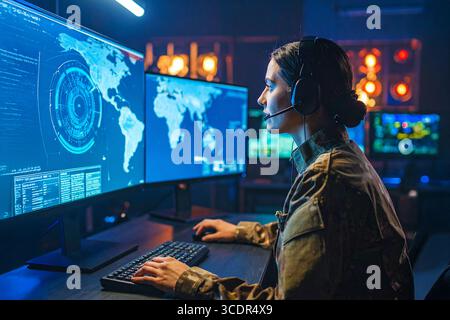 One of the series of photos : Military Analyst looking at large map screens with Stock Photo