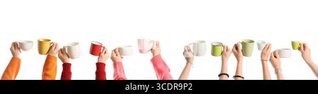 Many hands holding ceramic cups on white background Stock Photo