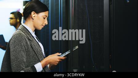 Inspection, maintenance and tablet with woman in server room for cybersecurity support. App, database and infrastructure with IT professionals in Stock Photo