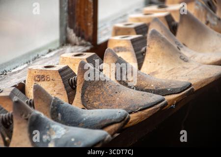 Wooden lasts in a historic clog maker's workshop at St Fagans National Museum of History, South Wales, UK Stock Photo