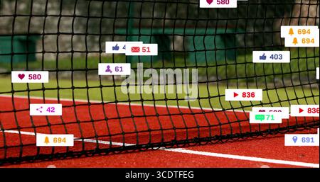 Displaying tennis net centered on red hard court with white line, showing social icons Stock Photo