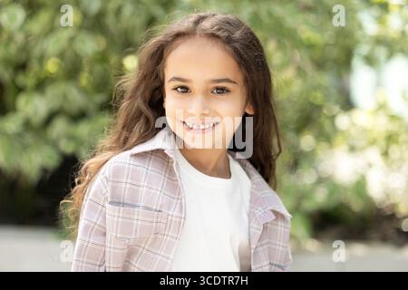 Pretty long-haired girl feeling excited and happy Stock Photo