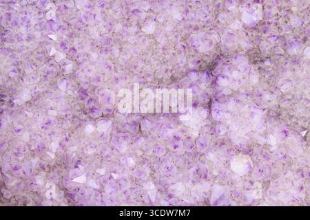 White and violet Amethyst Cactus Quarz stone closeup Stock Photo