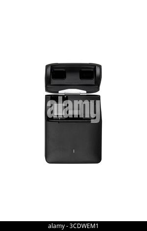 A black wireless microphone charging case with two microphones inside, isolated on white. Stock Photo