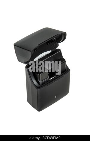 An open wireless microphone charging case with two mics inside, isolated on white. Stock Photo
