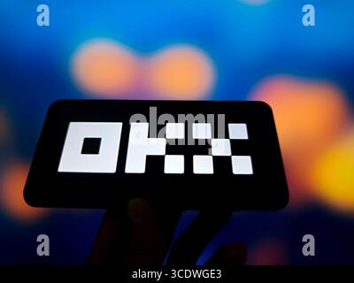 SUQIAN, CHINA - AUGUST 14, 2025 - A illustration photo shows OKX logo displayed in a smartphone in Suqian, Jiangsu Province, China on August 14, 2025. Stock Photo