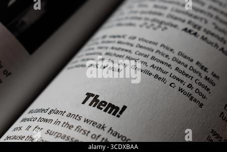 Close-up of bold text ‘THEM!’ printed on book page. Stock Photo