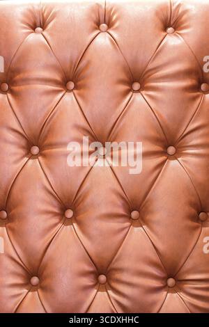 Reddish brown color of sofa seamless leather texture background. Stock Photo