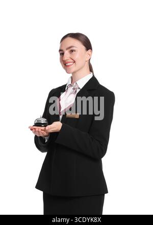 Smiling receptionist in uniform holding service bell on white background Stock Photo