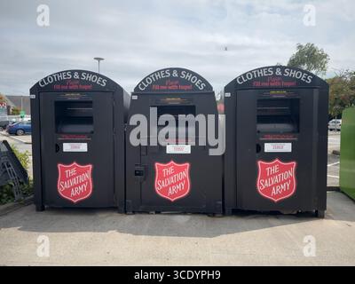 Three recycling bins for clothes and shoes, Formby Merseyside UK August 11th 2025 Stock Photo
