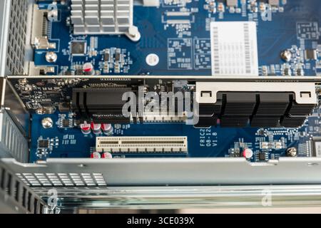 Synology M2D18 PCI Express x8 Adapter Card for Dual M.2 SSDs installed in a Synology RackStation RS3617xs+ network attached storage computer server Stock Photo