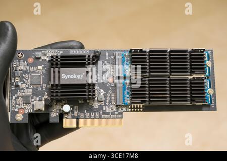 Synology M2D18 PCI Express x8 Adapter Card for Dual M.2 SSDs with Seagate IronWolf 510 SSD, M.2 PCIe Gen3 x4 NVMe SSD and heatsinks before assembly Stock Photo