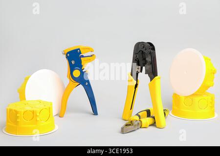 Electrician's tools on light background Stock Photo