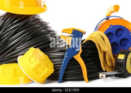 Rolled cables with electrician tools and electrical junction boxes on white background Stock Photo