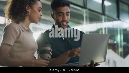 Teamwork, people and developers on laptop in office for help, software update or testing program. Staff, research and tech in office for IT Stock Photo