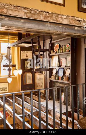 Interior of The Monro pub in Liverpool city centre,UK.A re-imagined 100 year old Dublin pub. Looking down through the rafters on to the floor below Stock Photo