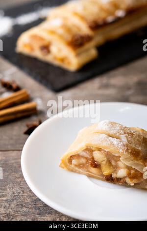 Homemade apple strudel on wooden table Stock Photo