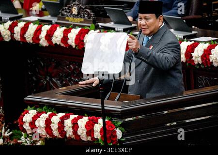 (250815) -- JAKARTA, Aug. 15, 2025 (Xinhua) -- Indonesian President Prabowo Subianto gestures during his state address at the Annual Session of the People's Consultative Assembly and the Joint Session of the House of Representatives and the Regional Representative Council in Jakarta, Indonesia, Aug. 15, 2025. Prabowo on Friday reaffirmed his strong commitment to combat corruption and safeguard forests across the country. Delivering his state speech ahead of the nation's 80th Independence Day anniversary on Aug. 17 in Jakarta, Prabowo emphasized his constitutional duty to eradicate graft and Stock Photo