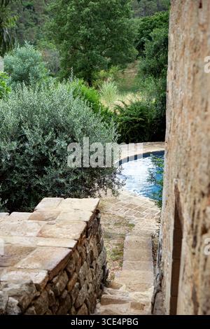 Stone stairs leading to the pool Stock Photo