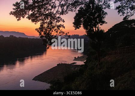 Golden-orange sunset over the Sangu River in Bandarban, Bangladesh Stock Photo