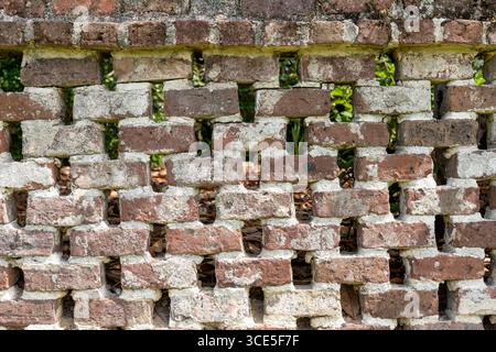 Lattice brick wall at Middleton Place Plantation, built with reclaimed bricks from the mansion ruins burned in 1865 during the Civil War. Stock Photo