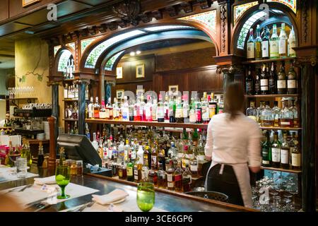 Woman working behind bar inside Rustico Ristorante, Telluride, San Miguel County, Colorado, USA Stock Photo