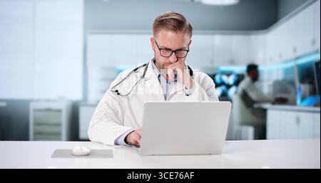 Physician Conducts Virtual Consultation Using Telehealth Technology In Medical Center. Stock Photo