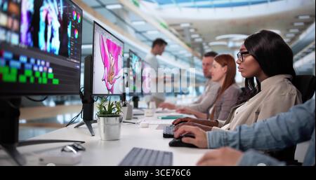 Professional Graphic Designer Utilizing Video Editing Software For Marketing Campaign Stock Photo