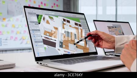 Senior Interior Designer Using 3D CAD Model For Property Remodel. Stock Photo